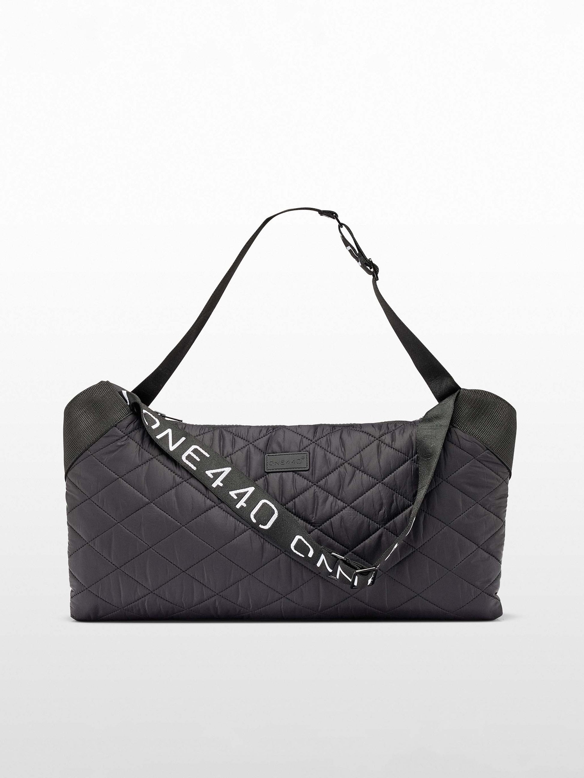 A black, zippered multipurpose one440 bag with a quilted design, featuring the brand name 'ONE440' on a strap.
