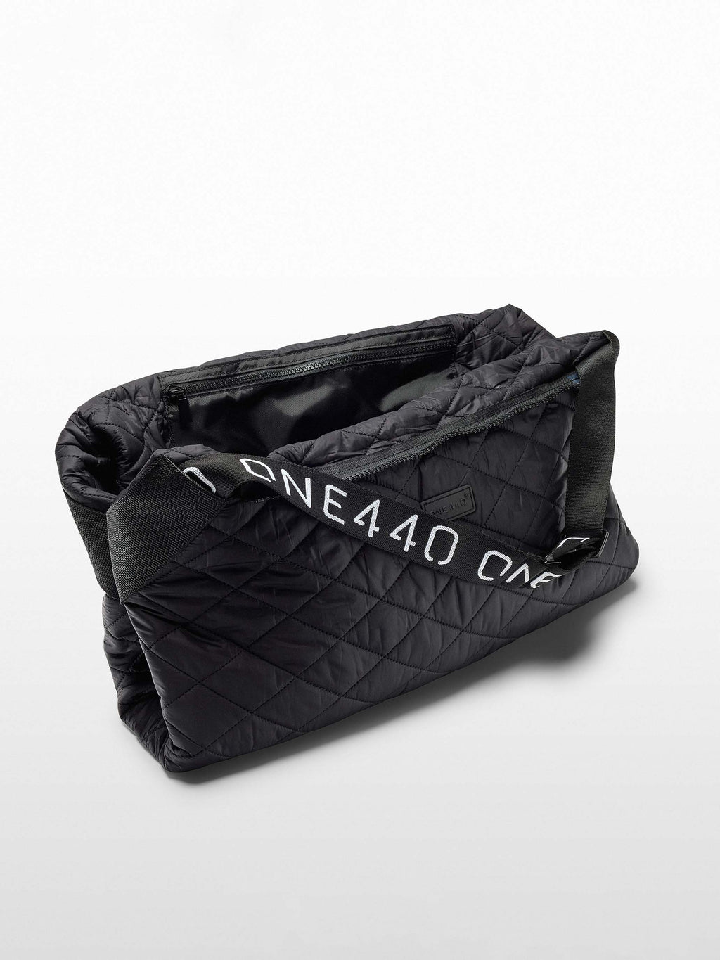 Black quilted one440 bag with 'one440' branding on a white background